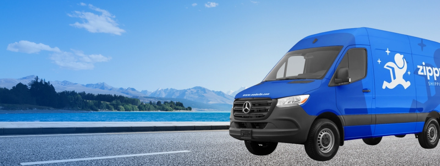 Image of a blue wrapped van on an open road